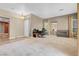 Spacious living room with neutral paint, fireplace, and bright natural light at 9900 Summer Ash Ct # 101, Las Vegas, NV 89134
