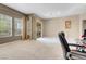 Bright living room features large windows and sliding glass door to outdoors at 9900 Summer Ash Ct # 101, Las Vegas, NV 89134