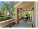 Covered outdoor patio with comfortable seating and ceiling fan, perfect for enjoying the well landscaped backyard at 9900 Summer Ash Ct # 101, Las Vegas, NV 89134