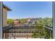 View from a balcony of a well maintained community with beautiful homes and a well-manicured landscape at 9992 Peak Lookout St, Las Vegas, NV 89178