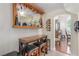 Charming bar area featuring custom wine racks, glassware storage, and a cozy seating arrangement perfect for entertaining guests at 9992 Peak Lookout St, Las Vegas, NV 89178