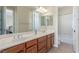 Bathroom featuring double sinks, marble countertop, and a shower-tub combination at 9992 Peak Lookout St, Las Vegas, NV 89178