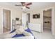 Brightly lit room featuring a plush dog on a bed and multiple storage options and a walk in closet at 9992 Peak Lookout St, Las Vegas, NV 89178