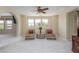 Large bonus room featuring neutral carpet, ceiling fan, and lots of natural light at 9992 Peak Lookout St, Las Vegas, NV 89178