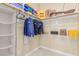 Neatly organized walk-in closet with shelving, hanging space, and room for accessories and storage at 9992 Peak Lookout St, Las Vegas, NV 89178