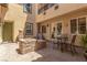 Private courtyard featuring a sitting area and fireplace at 9992 Peak Lookout St, Las Vegas, NV 89178