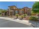 Charming two-story home with a three-car garage and well-maintained landscaping at 9992 Peak Lookout St, Las Vegas, NV 89178
