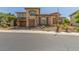 Charming two-story home with a three-car garage and well-maintained front yard at 9992 Peak Lookout St, Las Vegas, NV 89178