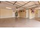 Oversized garage with epoxy floors and plenty of storage space, perfect for car enthusiasts at 9992 Peak Lookout St, Las Vegas, NV 89178