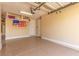 Well-lit garage featuring an epoxy floor, storage shelves, and a clean, organized space at 9992 Peak Lookout St, Las Vegas, NV 89178