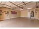Finished garage with epoxy flooring, storage solutions, and space for multiple vehicles at 9992 Peak Lookout St, Las Vegas, NV 89178