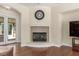 Bright and airy living room features a fireplace, wood floors and neutral wall color at 9992 Peak Lookout St, Las Vegas, NV 89178