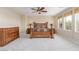 Main bedroom featuring a wooden furniture set, carpet, and dual windows at 9992 Peak Lookout St, Las Vegas, NV 89178