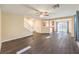 Inviting living room with hardwood floors, a staircase, and an open layout at 10072 Pelham Park Ave, Las Vegas, NV 89148