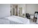 Bright bedroom featuring a mirrored closet, neutral walls, and carpet flooring at 10605 Moon Flower Arbor Pl, Las Vegas, NV 89144
