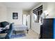Cozy bedroom with a desk, window, and a black dresser at 10605 Moon Flower Arbor Pl, Las Vegas, NV 89144
