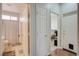 Hallway featuring doorways to a bathroom, bedroom, and another room at 10605 Moon Flower Arbor Pl, Las Vegas, NV 89144