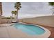 Inviting kidney-shaped pool featuring a lounge area with modern patio furniture and tall palm trees in a private backyard at 10605 Moon Flower Arbor Pl, Las Vegas, NV 89144