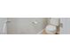 White toilet in a bathroom with neutral walls and light flooring at 10605 Moon Flower Arbor Pl, Las Vegas, NV 89144