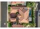 An aerial view showcases this home's unique roof, landscaping, pool, and spa at 10671 Capesthorne Way, Las Vegas, NV 89135