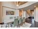Elegant dining room with a soaring ceiling, large windows and seating for six at 10671 Capesthorne Way, Las Vegas, NV 89135