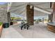 Outdoor pavilion with stone columns and overhead shelter, providing a shaded seating and cooking area at 10671 Capesthorne Way, Las Vegas, NV 89135