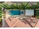 Aerial shot of the pool area with a spa and lounge chairs at 10671 Capesthorne Way, Las Vegas, NV 89135