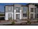 Contemporary three-story home boasts stone and stucco, plus modern windows and a stylish entryway at 1168 Heliodor Ave # Lot 152, Henderson, NV 89011