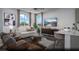 Bright living room features large windows, modern decor, and comfortable seating, perfect for relaxation at 1168 Heliodor Ave # Lot 152, Henderson, NV 89011