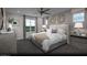 Serene main bedroom offers soft lighting, neutral tones, and a comfortable bed for a relaxing retreat at 1168 Heliodor Ave # Lot 152, Henderson, NV 89011