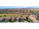 Aerial view of homes in a golf community with mature landscaping and desert mountain views at 1187 Mohave Dr, Mesquite, NV 89027