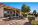 Inviting covered patio with seating and manicured landscaping creates a serene outdoor living space at 1187 Mohave Dr, Mesquite, NV 89027