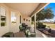 Covered patio with seating overlooking a golf course and natural landscape at 1187 Mohave Dr, Mesquite, NV 89027
