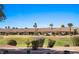 Lush backyard view featuring manicured lawns and palm trees in a desert community at 1187 Mohave Dr, Mesquite, NV 89027