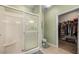 Bathroom with a glass-enclosed shower, toilet, and a walk-in closet at 1187 Mohave Dr, Mesquite, NV 89027