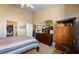 Cozy bedroom featuring a comfortable bed, dresser, and ample closet space at 1187 Mohave Dr, Mesquite, NV 89027