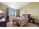 Inviting bedroom with natural light, ceiling fan, and a comfortable-looking bed at 1187 Mohave Dr, Mesquite, NV 89027