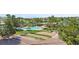 Community pool, barbecue pavilions, and bocce ball courts surrounded by desert landscaping and mature trees at 1187 Mohave Dr, Mesquite, NV 89027
