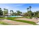 Community pool, BBQ pavilions, and grassy areas surrounded by palm trees in a sunny neighborhood at 1187 Mohave Dr, Mesquite, NV 89027