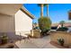 Inviting courtyard with table and chair, potted plants, and a glimpse of the neighborhood beyond at 1187 Mohave Dr, Mesquite, NV 89027
