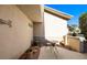 Charming courtyard with a small table, chair, potted plants, and a tranquil setting next to the home at 1187 Mohave Dr, Mesquite, NV 89027