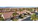 Stunning aerial view showcasing the home's tile roof, lush landscaping, and convenient attached two-car garage at 1187 Mohave Dr, Mesquite, NV 89027
