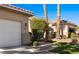 Charming single-story home with a two-car garage, well-manicured lawn, and desert landscaping at 1187 Mohave Dr, Mesquite, NV 89027