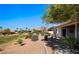 Exterior view highlighting the landscaped backyard and community greenery at 1187 Mohave Dr, Mesquite, NV 89027