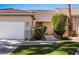 Charming single-story home with a well-manicured lawn and desert landscaping at 1187 Mohave Dr, Mesquite, NV 89027