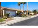Charming street view of a single-Gathering home with a well-maintained lawn and a two-car garage at 1187 Mohave Dr, Mesquite, NV 89027