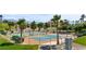 Outdoor tennis and basketball courts with manicured landscaping, palm trees, and distant mountain views at 1187 Mohave Dr, Mesquite, NV 89027