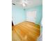 Bedroom with hardwood floors, ceiling fan, and a sliding-door closet at 1318 Pine Terrace Ct, North Las Vegas, NV 89031