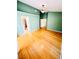 Large primary bedroom with hardwood floors, ceiling fan and ensuite bathroom at 1318 Pine Terrace Ct, North Las Vegas, NV 89031