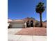 Charming single-story home with a well-maintained front yard and two car garage at 1318 Pine Terrace Ct, North Las Vegas, NV 89031
